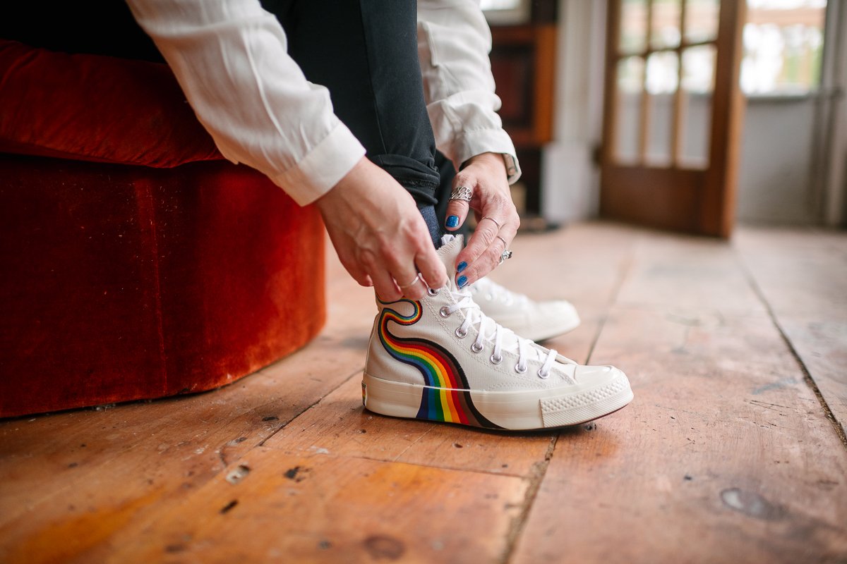 Bride putting on shoes for her wedding LGBT wedding