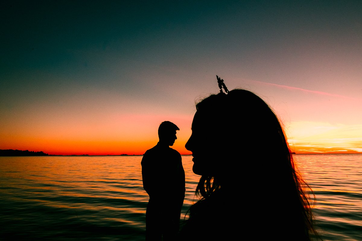 Man and woman with sunset background