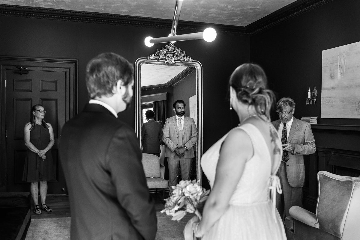 Black and white image of bride and groom enjoying their wedding
