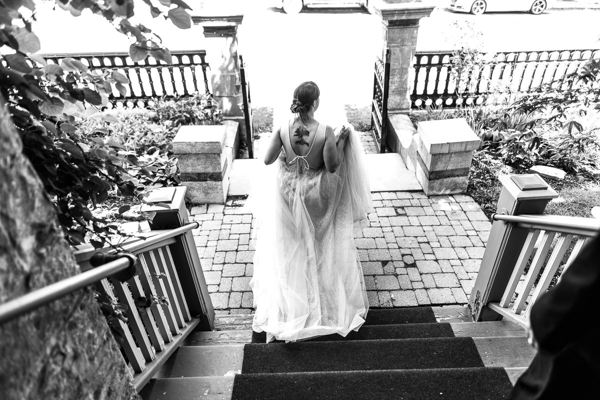 Bride walking down the street in wedding gown