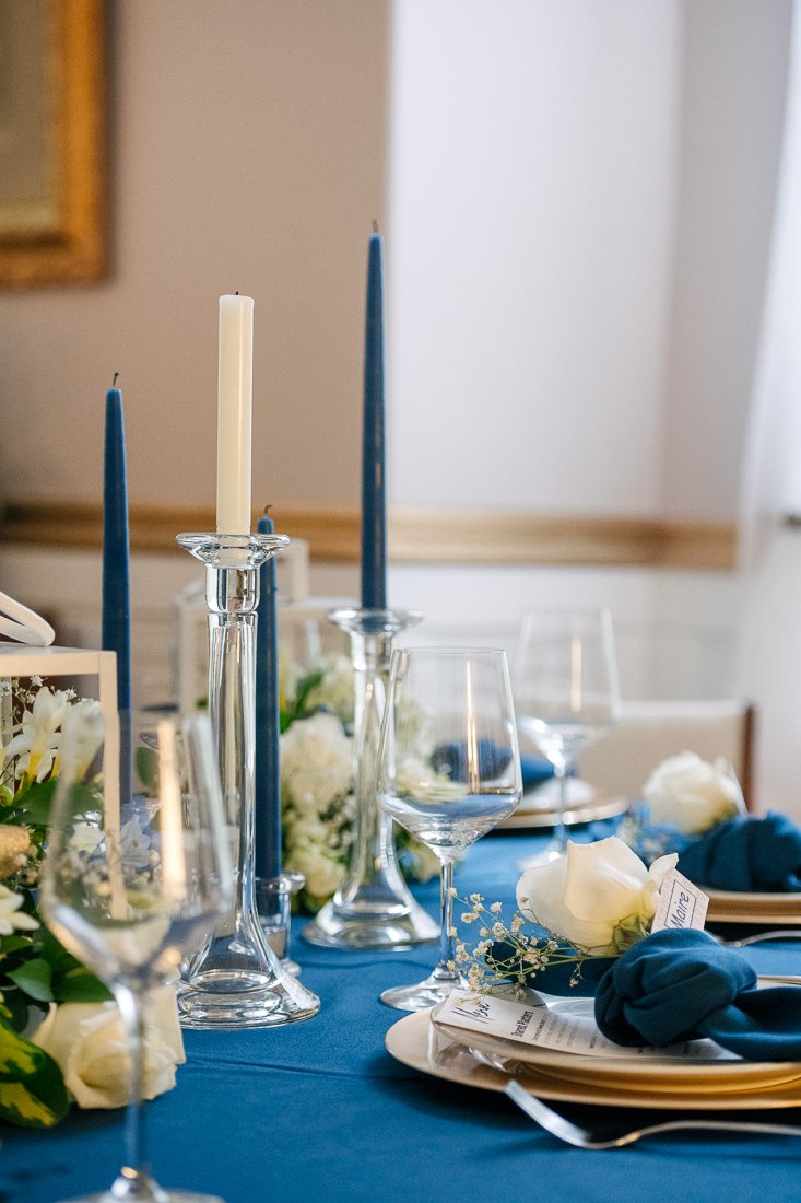 View of the dining table, glasses, flowers and decor