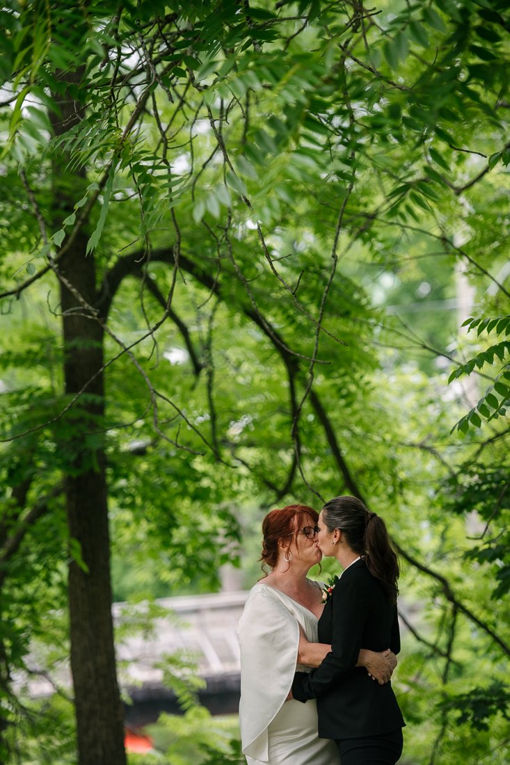 Brides kissing each other after wedding