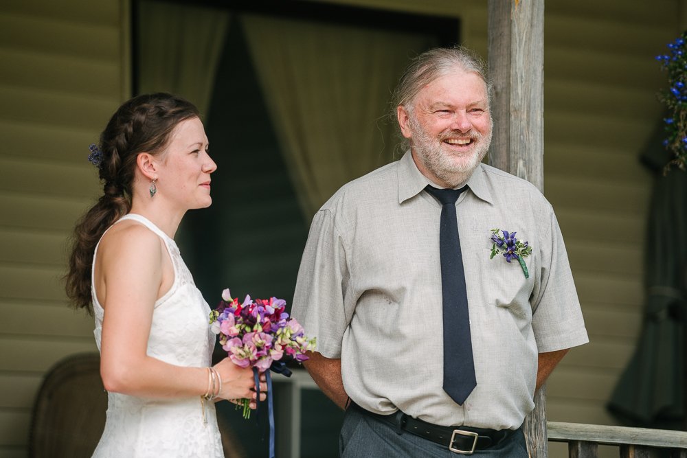Happy bride with her dad ready to walk down the aisle