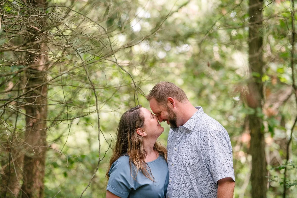 Woman kissing man on the engagement day