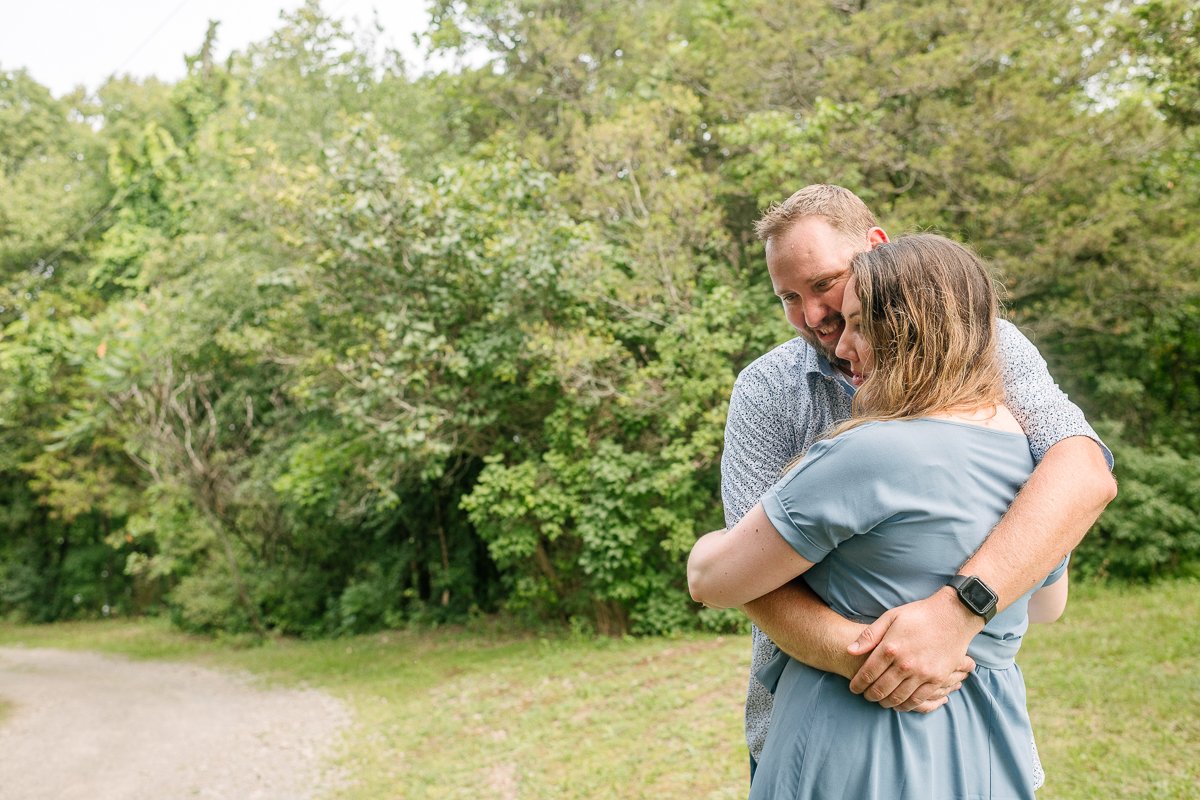 Couple hugging each other on their engagement session.