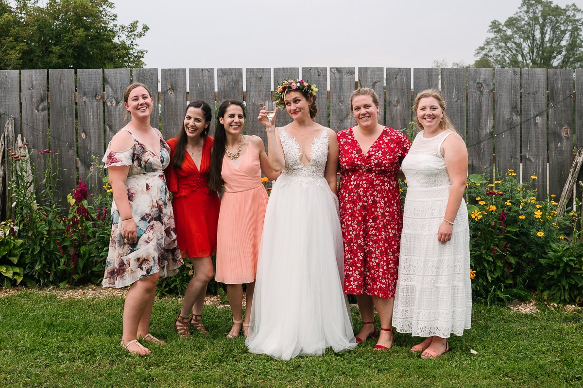 Bride with her bridesmaid and family at her wedding. 