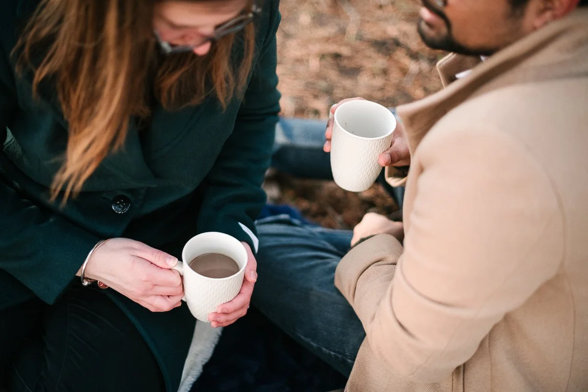 Couple drinking tea coffee together on their proposal. 