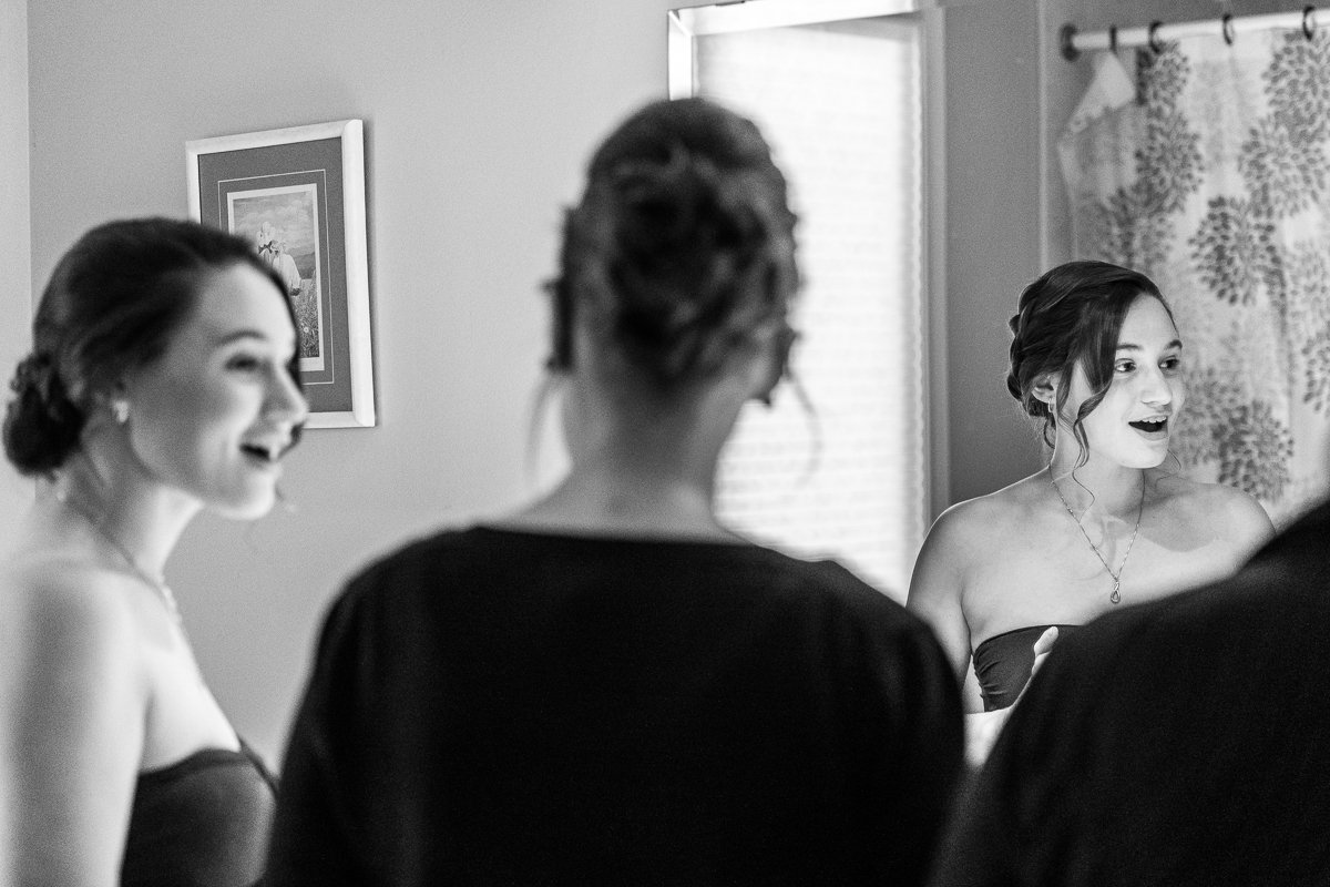 Black and white image of bride getting ready. 