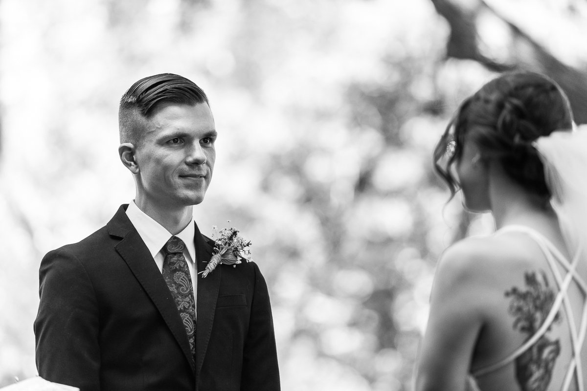 Black and white image of Bride and groom at their wedding. 