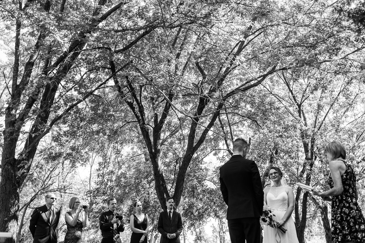 Black and white image of Bride and groom at their wedding. 