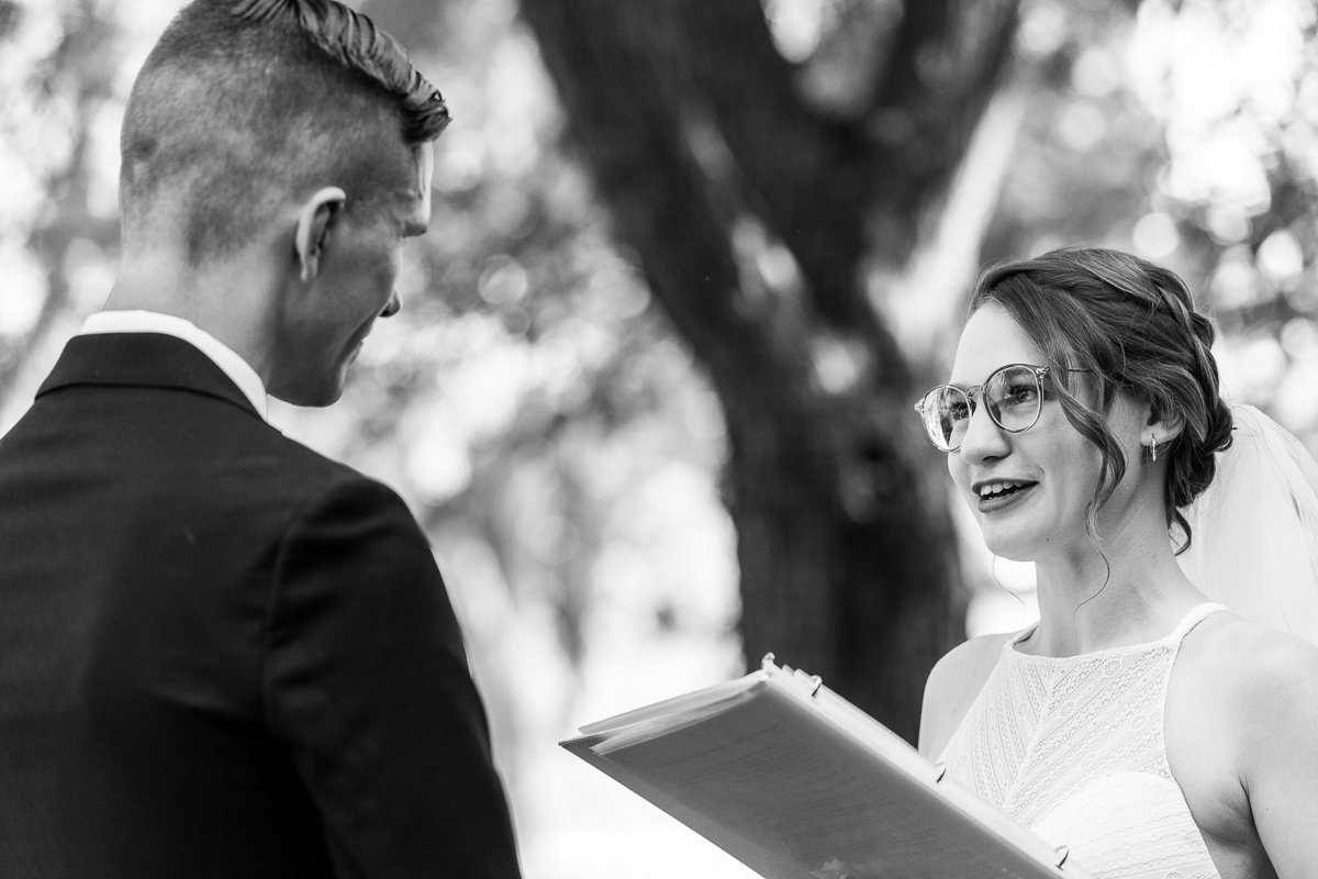 Black and white image of Bride and groom saying yes