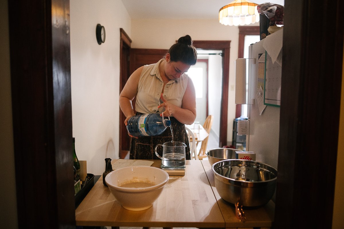 Woman cooking food making sourdough.