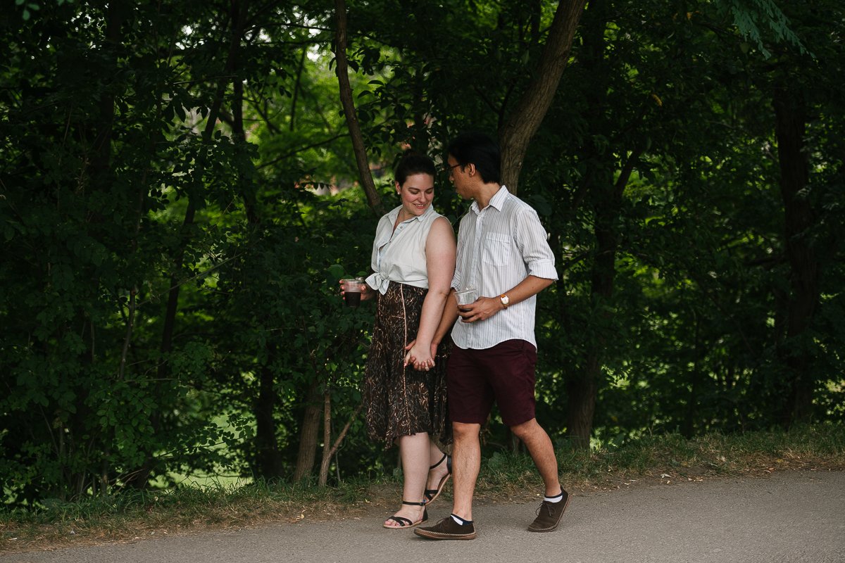 Couple in white dress walking hand in hand. 