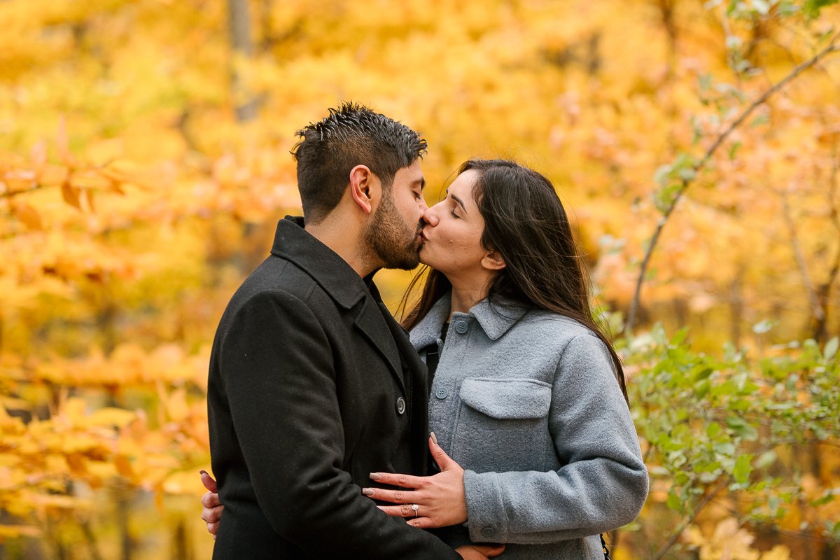 Couple kissing each other after engagement