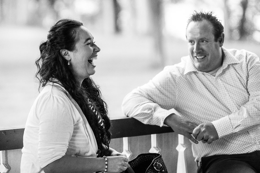 Black and white image of couple laughing out loud