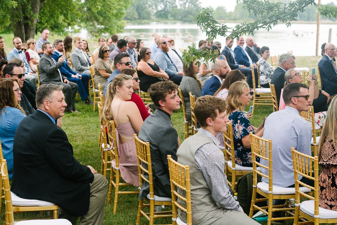 Guests sitting and enjoying wedding ceremony