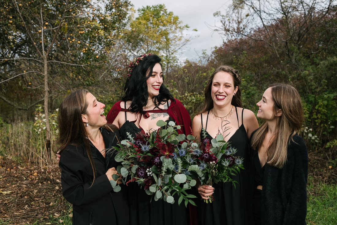 Bride and her bridesmaids with the wedding red wedding bouquet