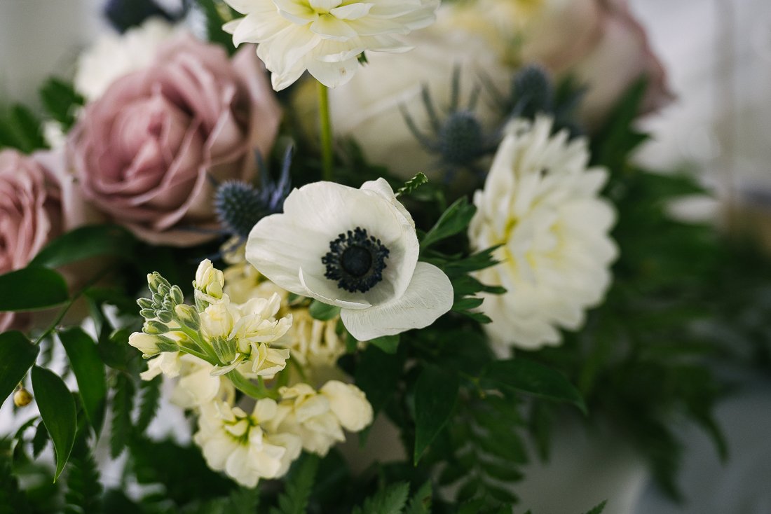 White, cream and crimson flowers at the wedding