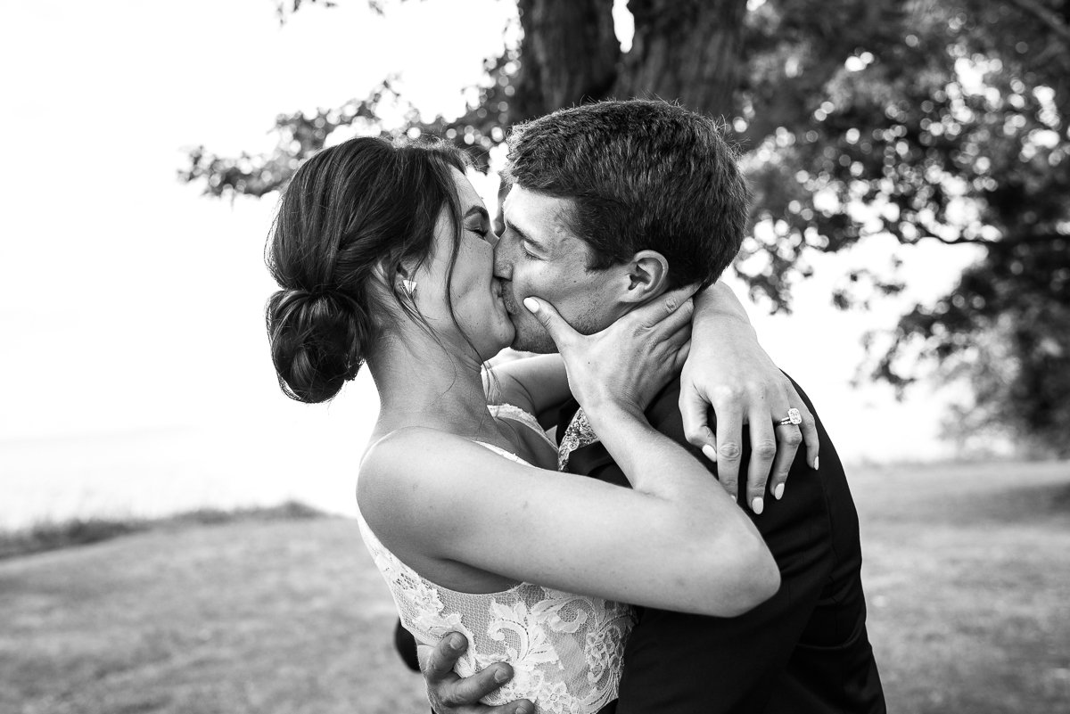 Bride and groom kissing after the wedding
