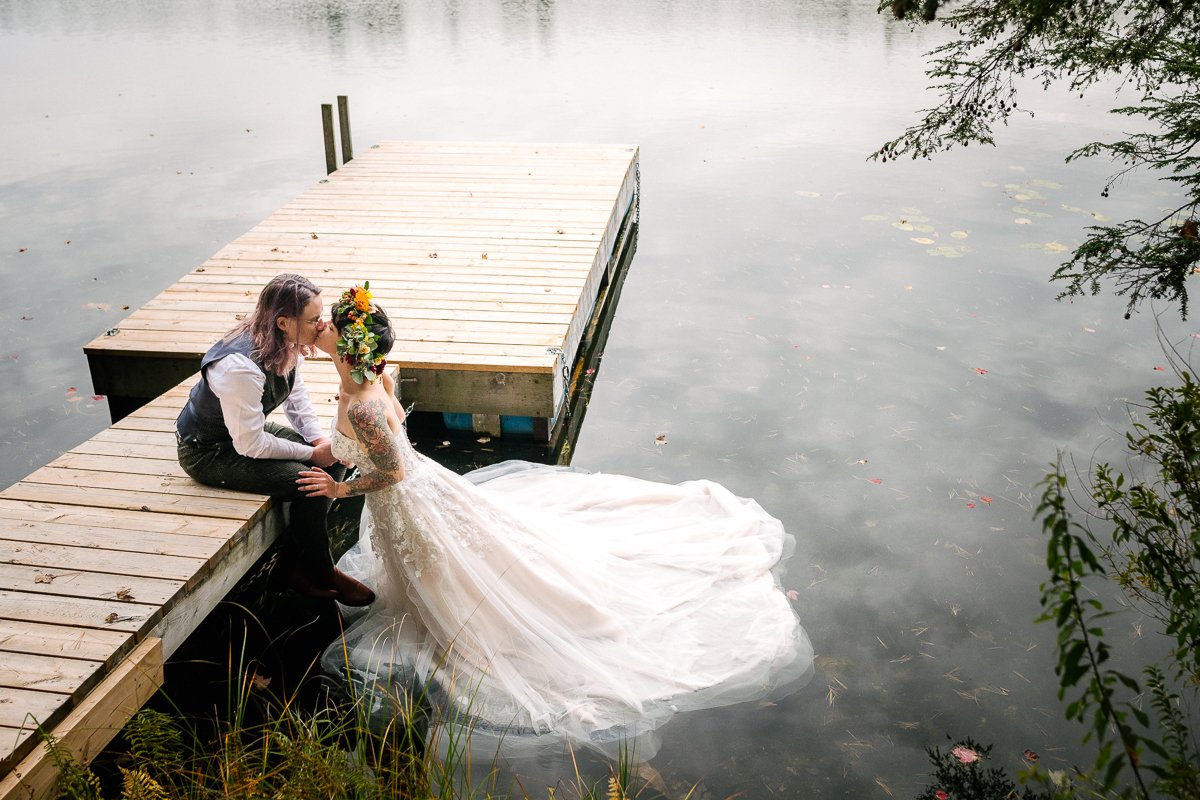 Bride and groom kissing in the lake