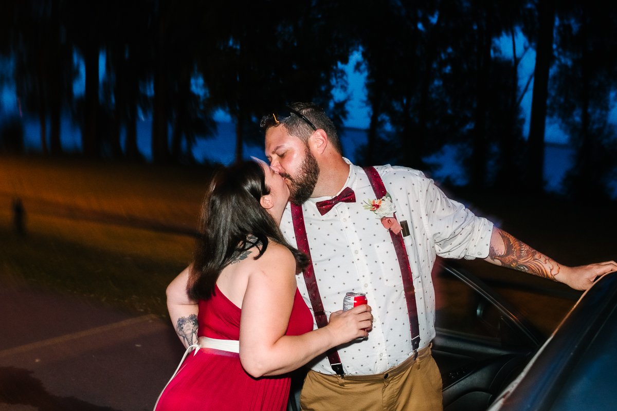 Bride and groom kissing outdoor in the night