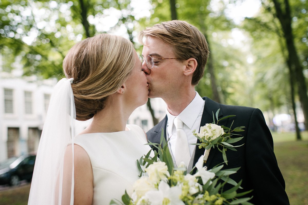 Closeup of bride and groom kissing