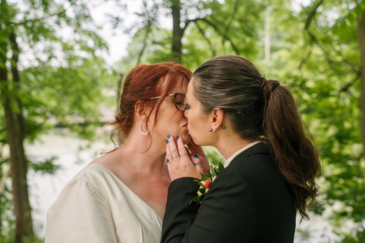 Brides kissing each other after wedding. LGBTQ wedding