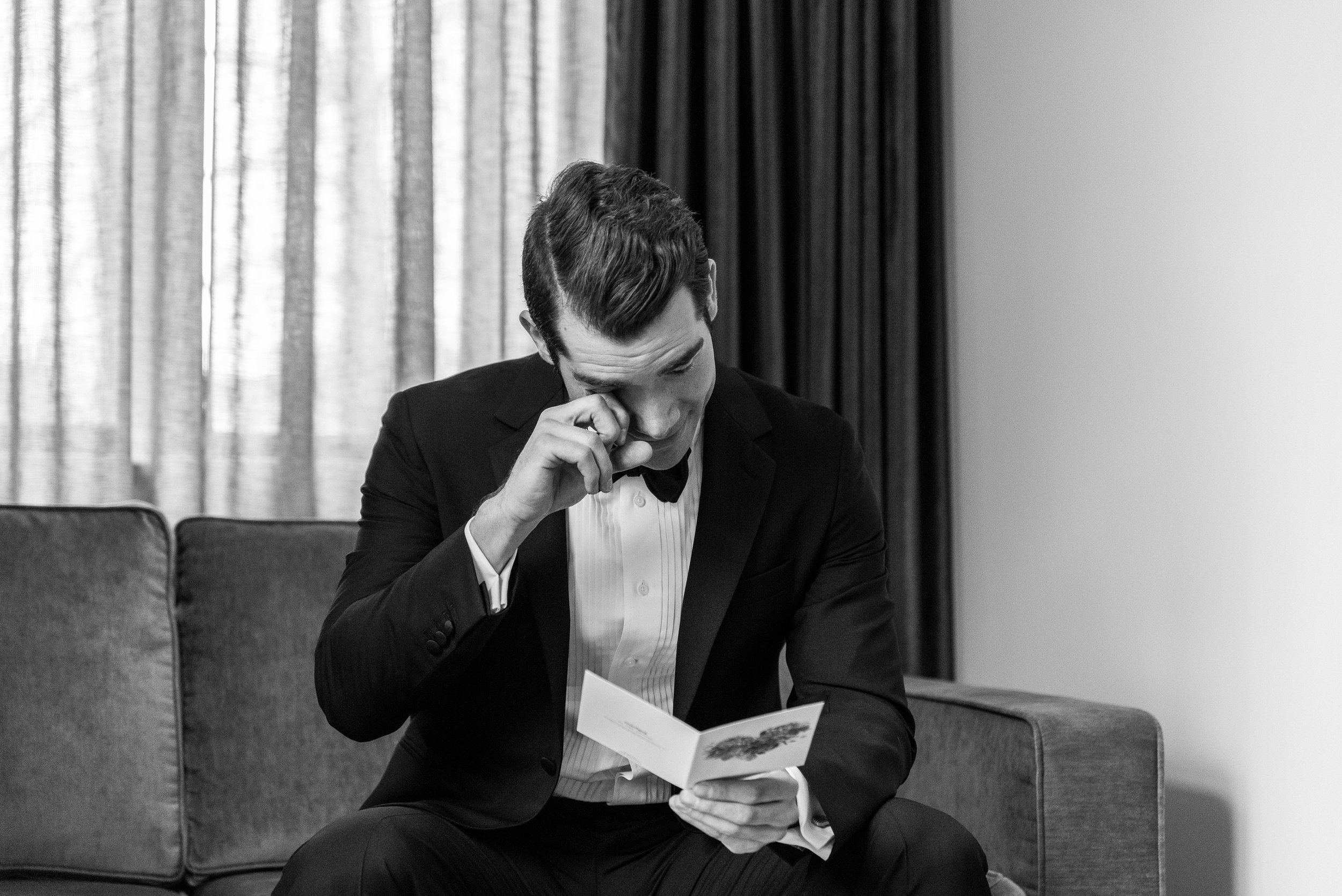 groom reading his wife's handwritten  letter for him.