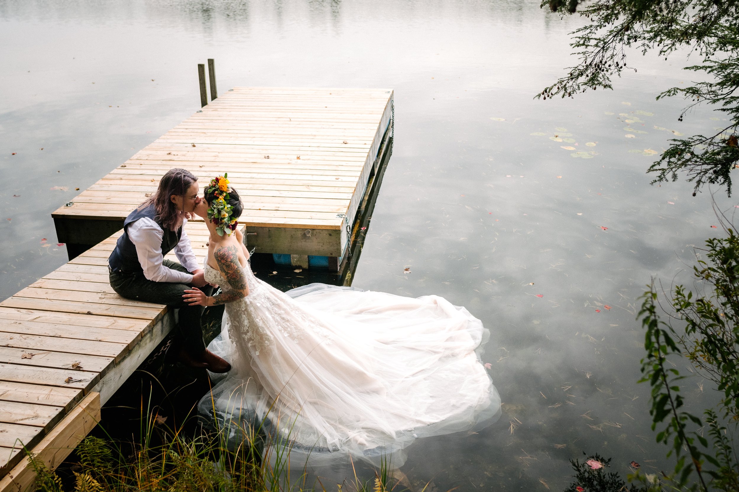 Bride and groom's kissing in the lake after the wedding. 