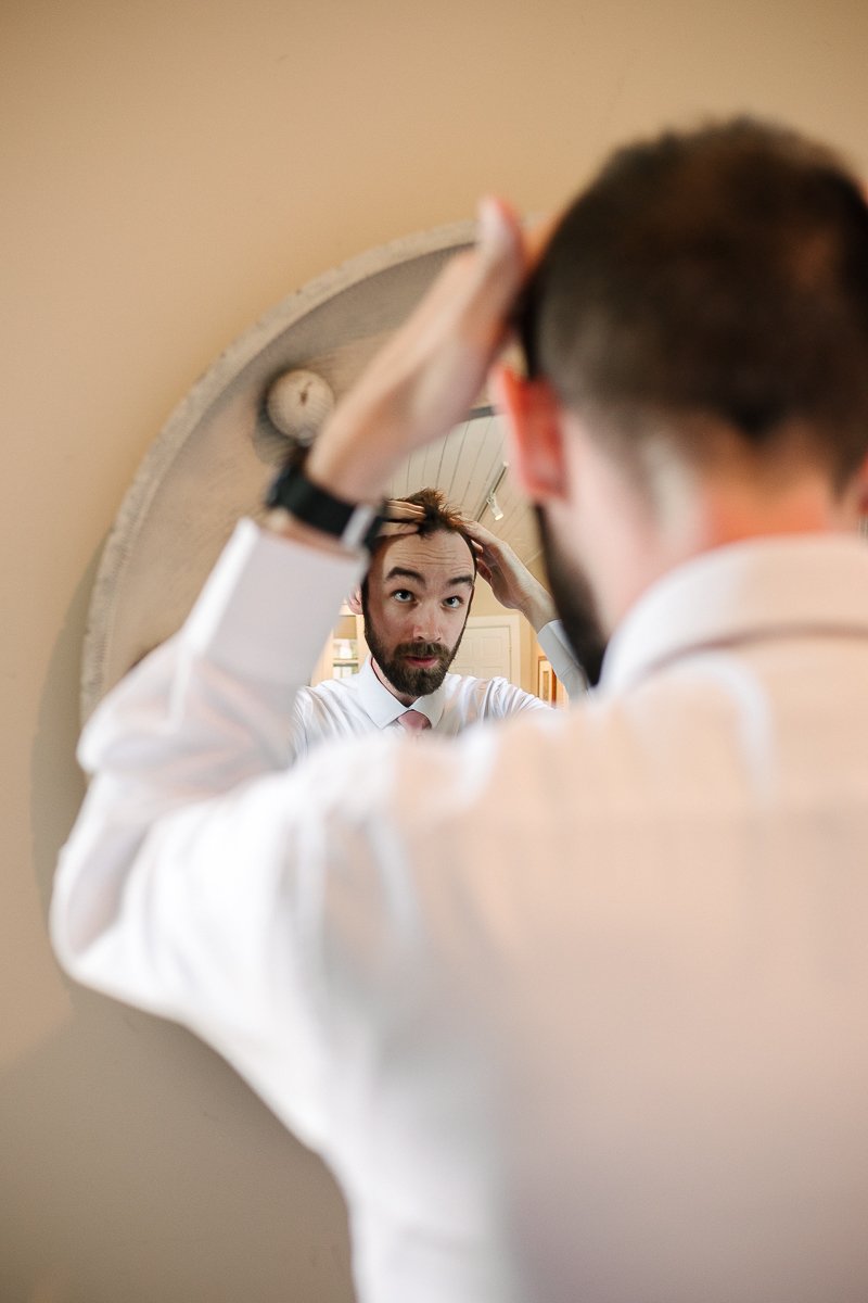 Groom getting ready for his wedding. 