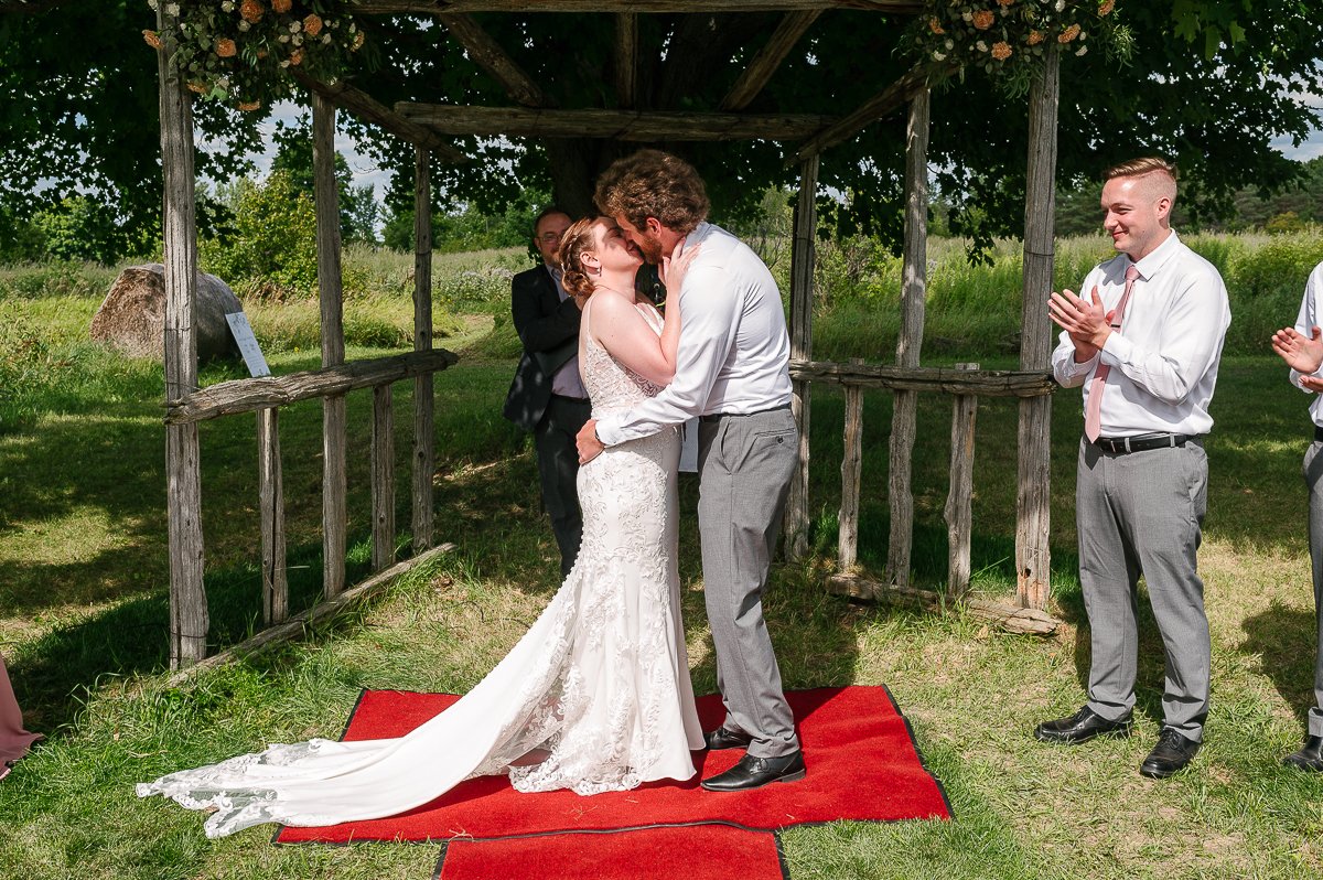 Bride and groom with their first kiss.