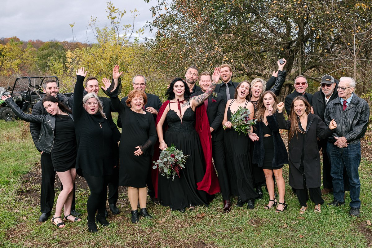 Family photo of halloween themed wedding