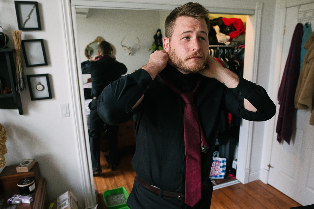 Groom getting ready for his halloween themed wedding.
