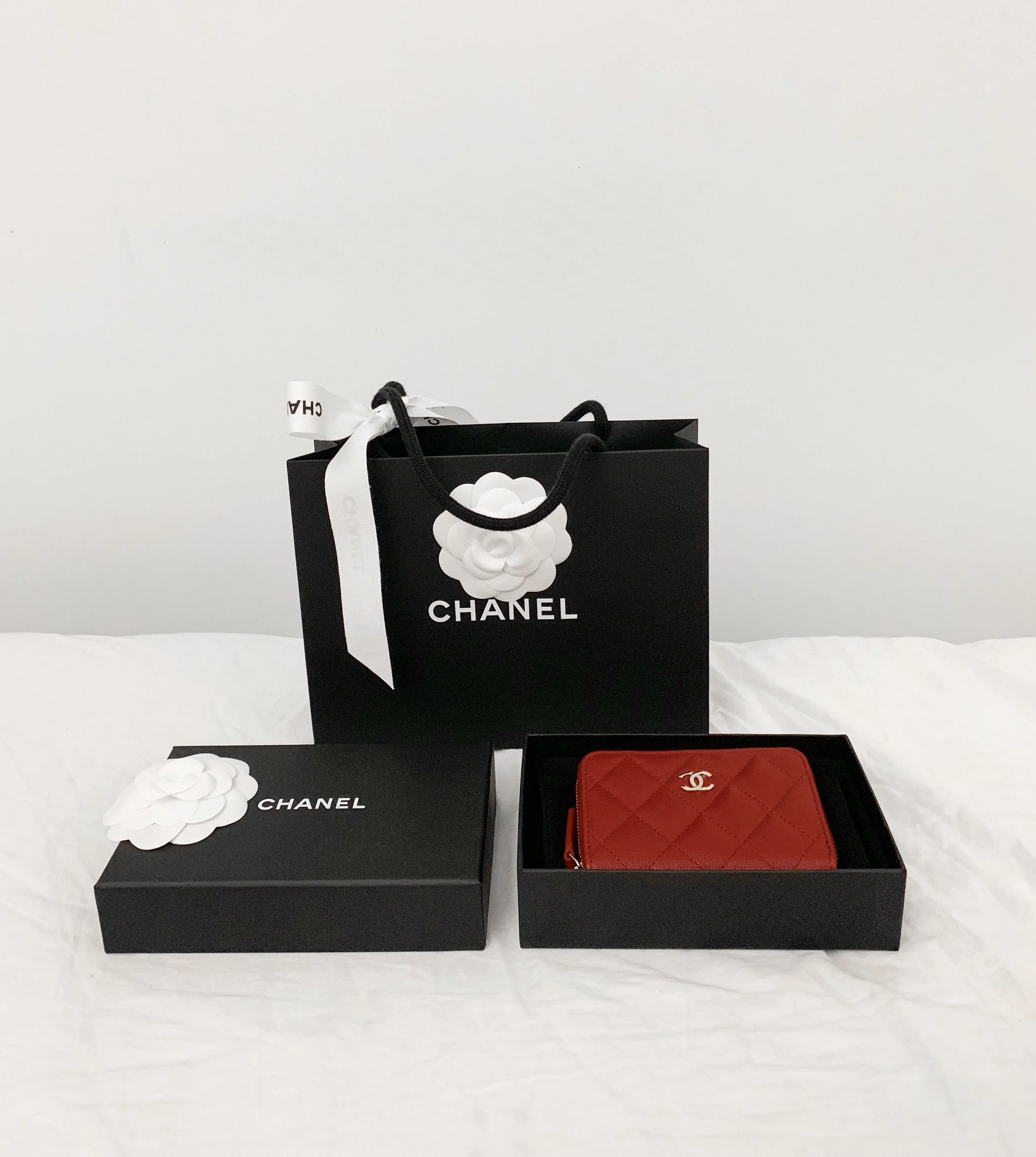 I saw this Red Zip Coin Purse in Caviar leather and Gold metal and I instantly fell in love. It is the most perfect shade of red - a true red. The leather also has a beautiful shine to it. This is priced at $600 usd, before sales tax.