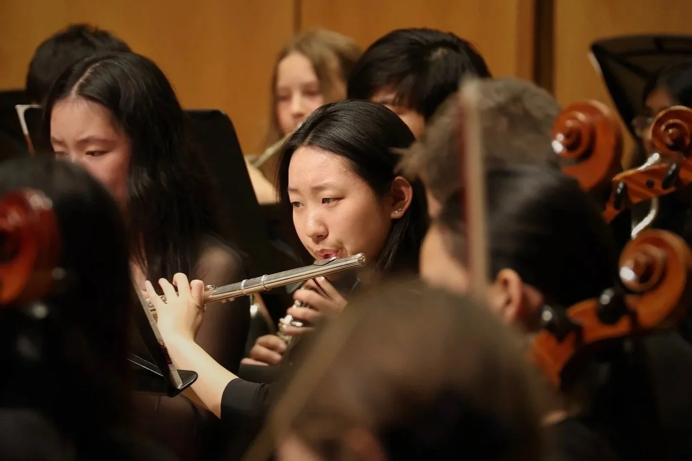 Photo of a flutist focused in the orchestra