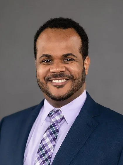 Man smiling in a suit