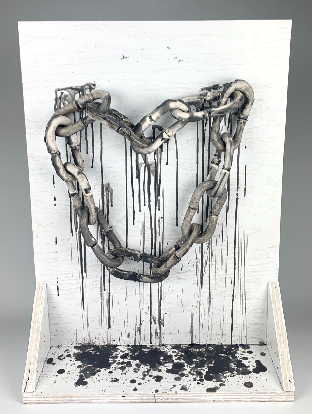  Emma Sock, Chained Together, Plaster, Wax, Wood, 18” x 6” x 24,” 2020.  