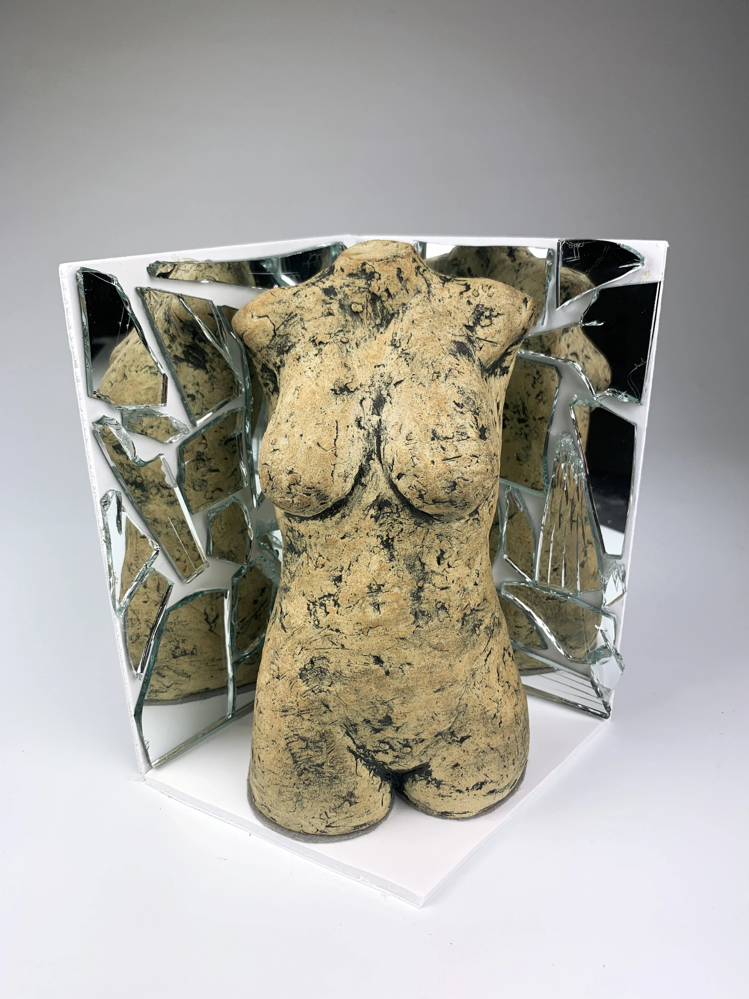  Emma Sock,  A Broken Reflection of Self , raku clay, mirror, foam board, 2021.  
