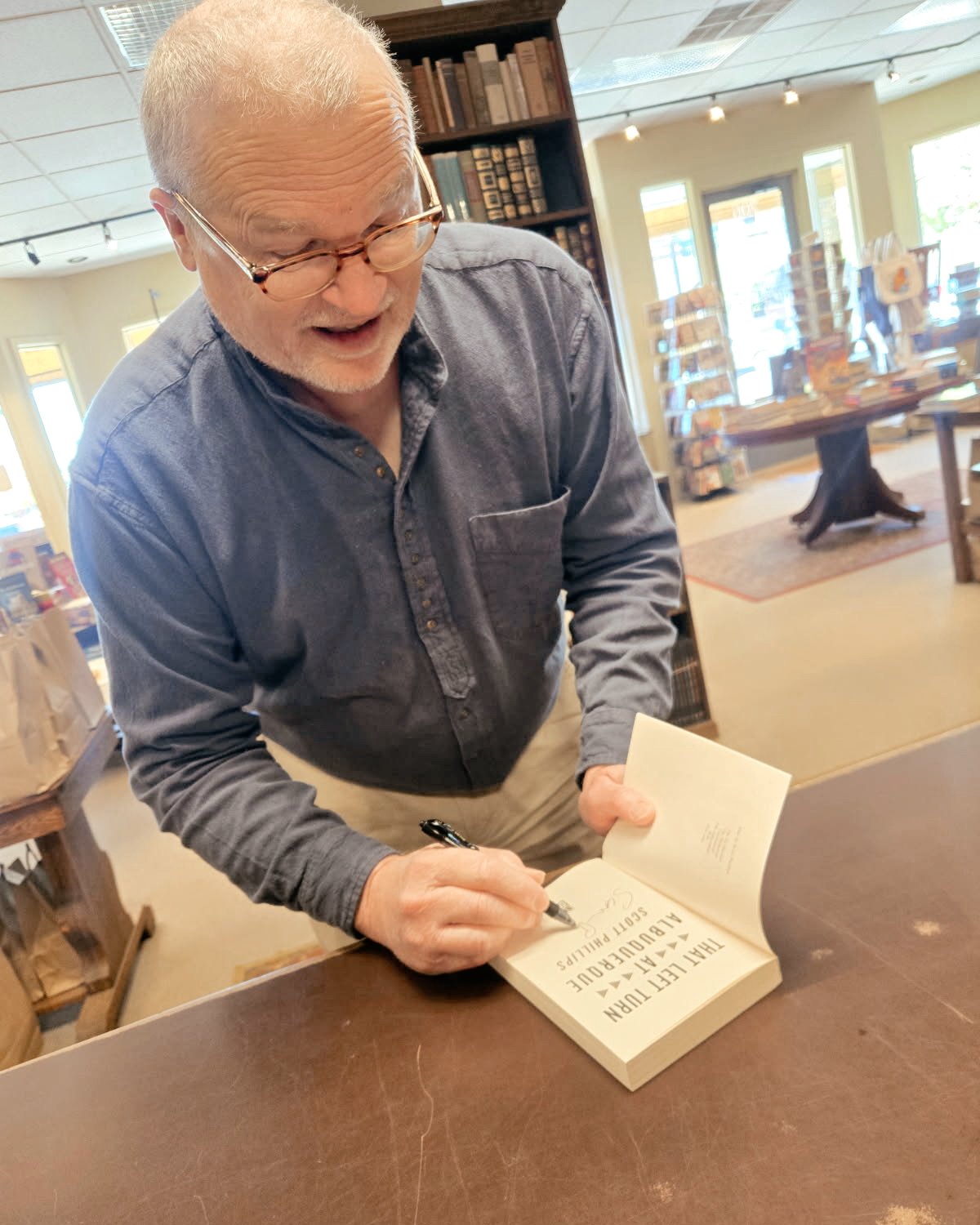 Author Scott Phillips stopped by to sign his book &ldquo;That Left Turn at Albuquerque.&rdquo; ✍️
Always a joy to meet the people behind the stories on our shelves &mdash; we&rsquo;re thankful for the authors who share their work with our community. 
