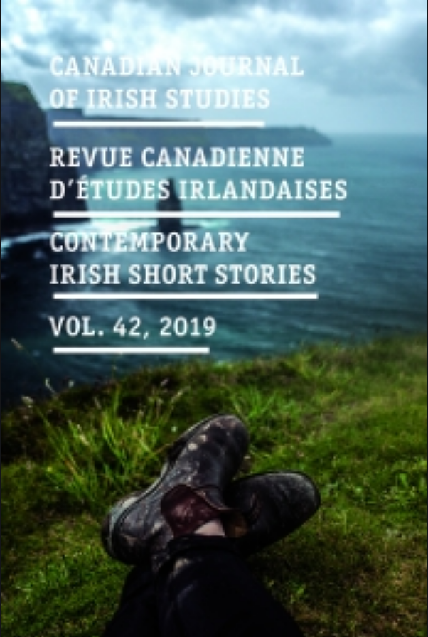 Cover of a publication titled 'Canadian Journal of Irish Studies, Revue Canadienne d'Études Irlandaise, Contemporary Irish Short Stories, Vol. 42, 2019'. The background shows a scenic coastal landscape with green grass, a body of water, and cloudy skies. In the foreground, a person is resting with their legs crossed, wearing black, muddy boots.