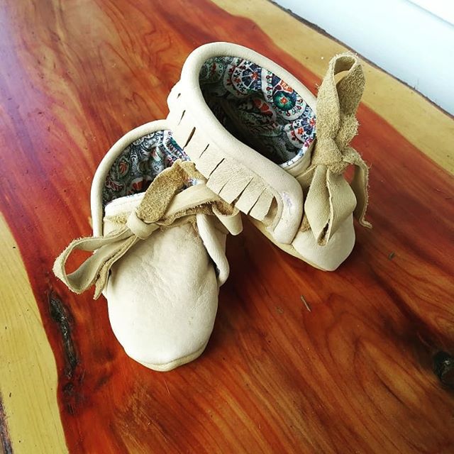 We're on to making baby shoes now! Penny's first moccasins! Swipe to see them on her! She's not quite sure about this whole shoe thing.... #baby #babyshoes #moccasins #sewing #leather #babymoccs