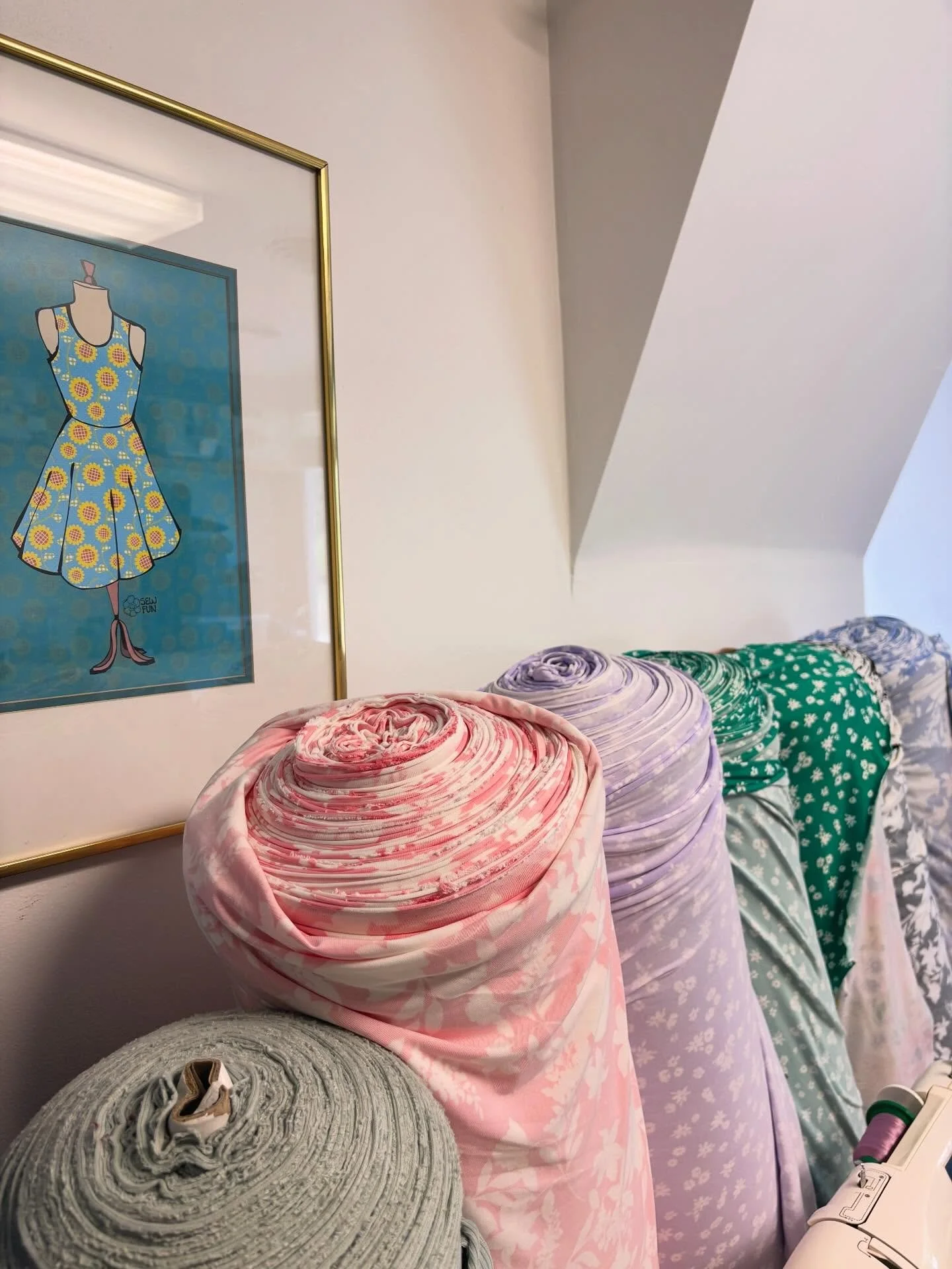 Fabric Day! Rolls of fabric have been shipped to Sewfun and now we are busy rolling them onto bolts. We have many solid broad cloth and knits this summer and of course lots of pretty patterns!!