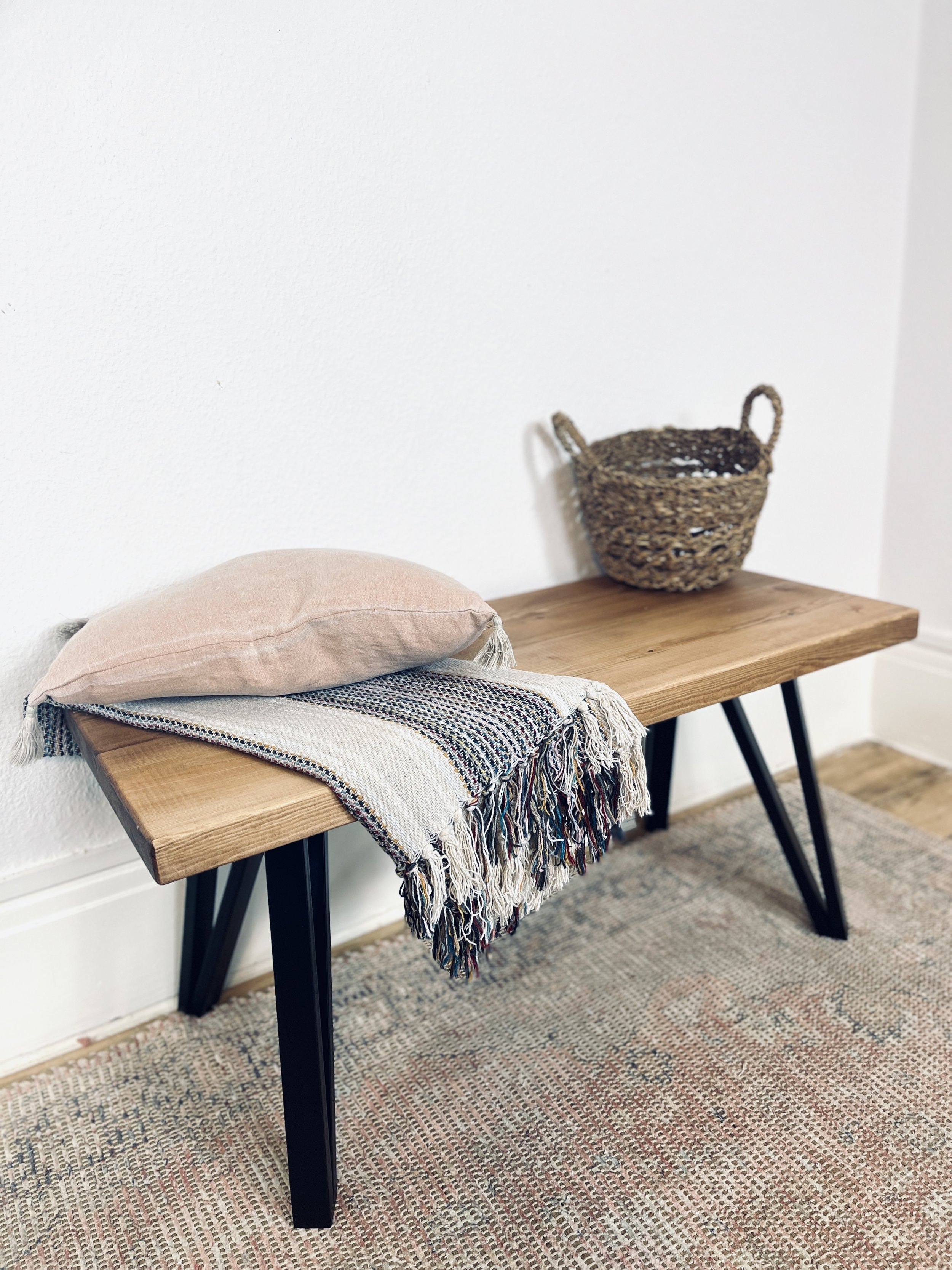 Introduce sleek piece to decor, Handcrafted Wood Bench, tapered steel legs for contemporary touch. Elevate space. #handcrafted #woodbench #taperedlegs