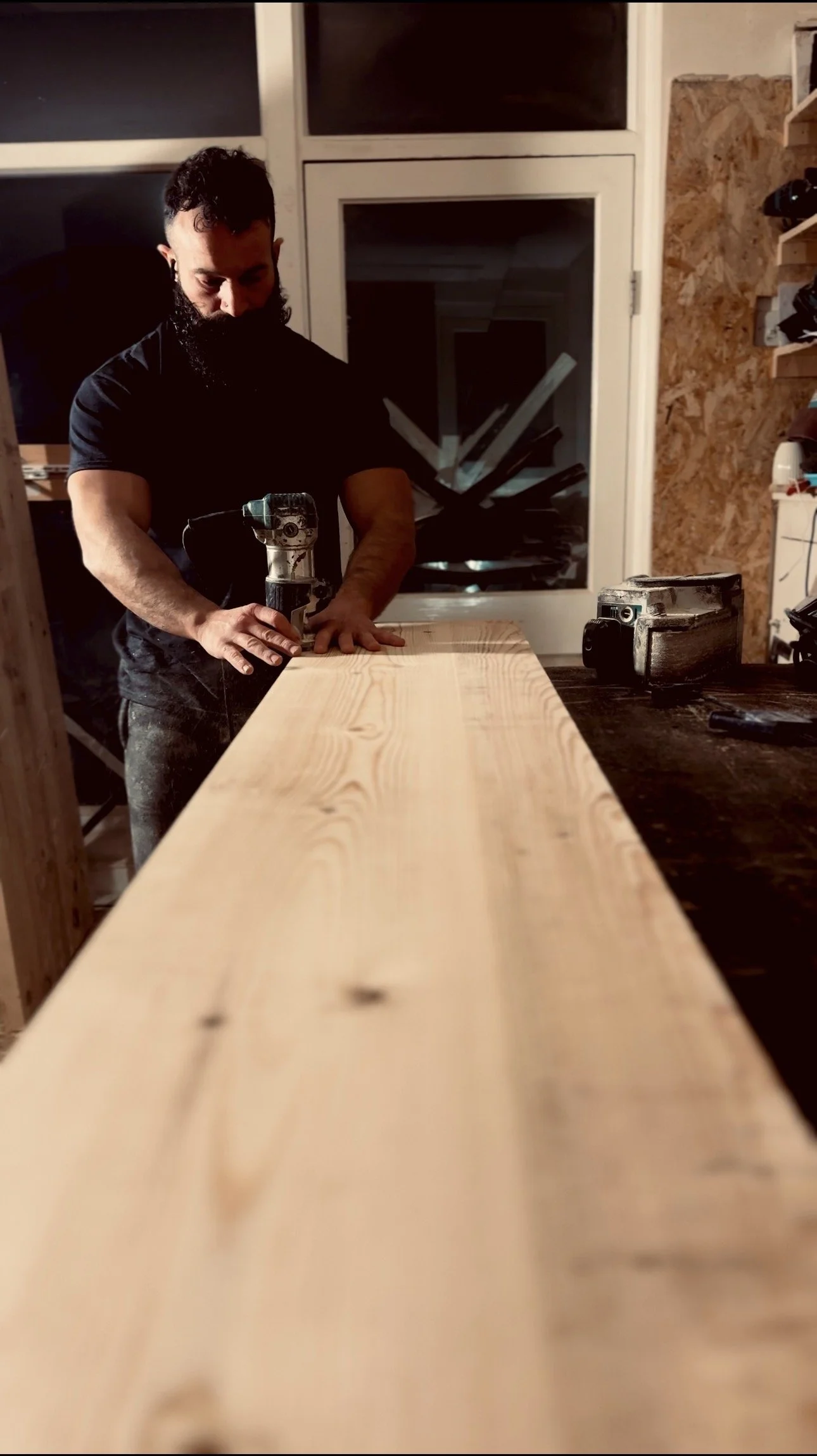 Routing a roundover edge on a solid Swedish redwood monitor stand in my workshop, Artemis London.