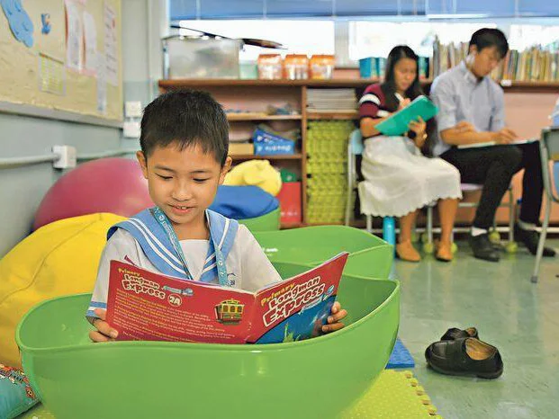 Natalie’s student enjoying his reading session in one of the Turtle Back-shaped flexible seatings in the Kinesthetic Classroom