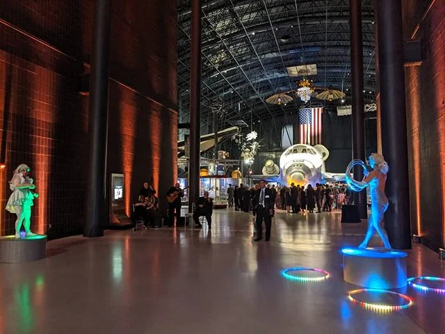 Is that the Space Shuttle Columbia behind the circus performers? YES!
.
Is that an SR-71 next to the dinner tables? YES!
.
The International Astronautical Congress gala dinner was at the Steven F. Udvar-Hazy Center | National Air and Space Museum. Qu
