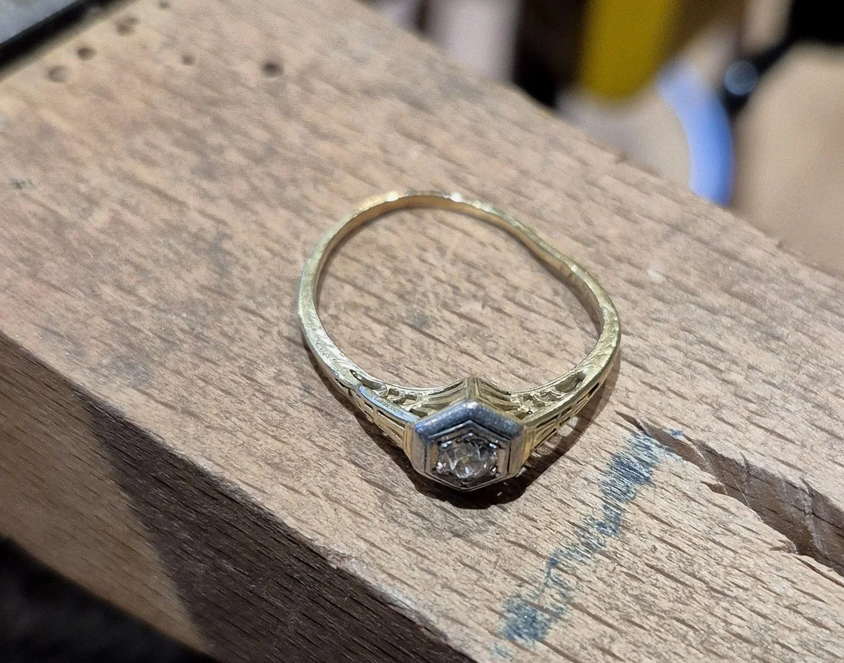 The original damaged heirloom ring from which the diamond was extracted