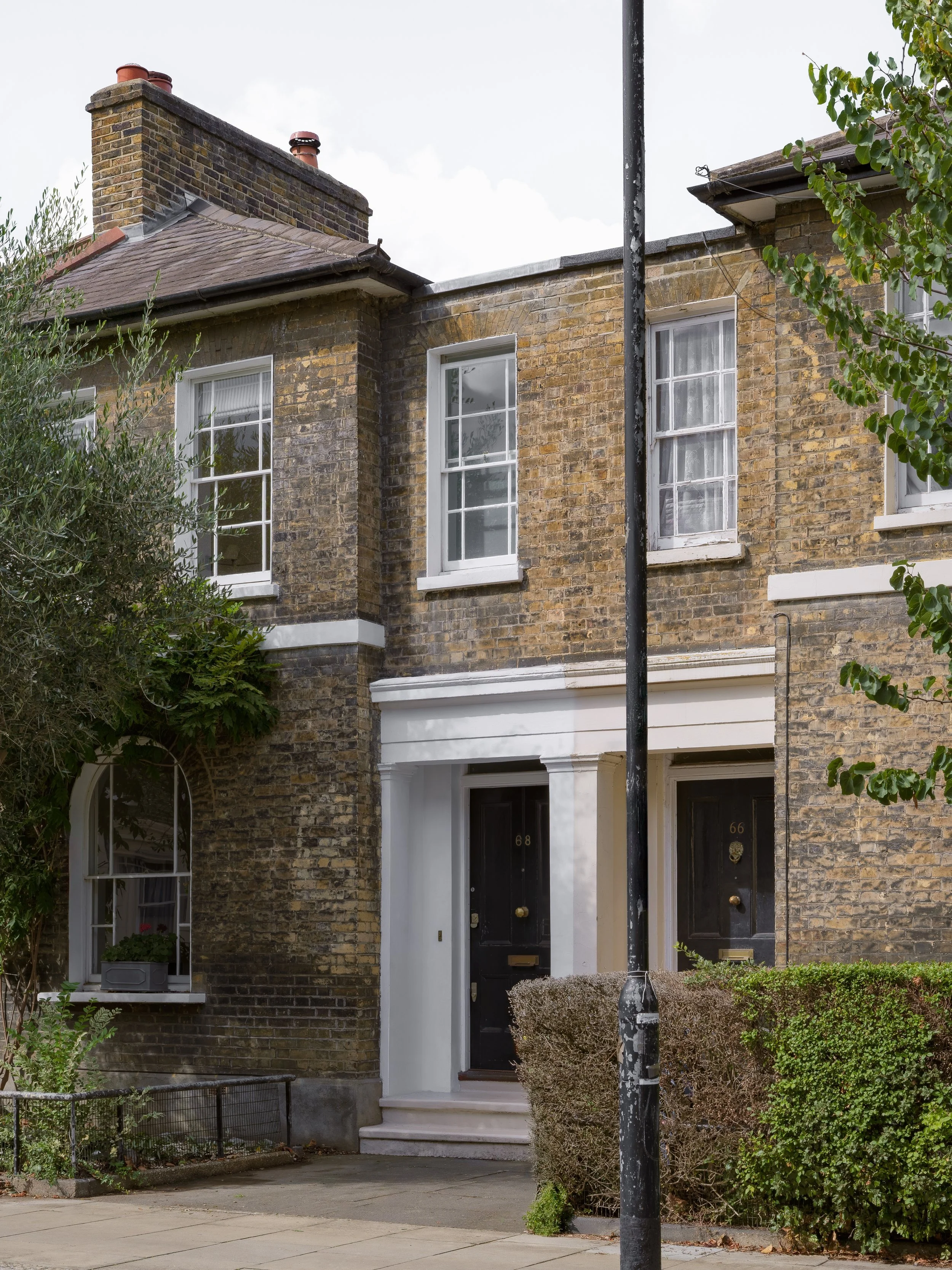 Street frontage of a Grade II listed early Victorian townhouse on Lorrimore Road, Walworth