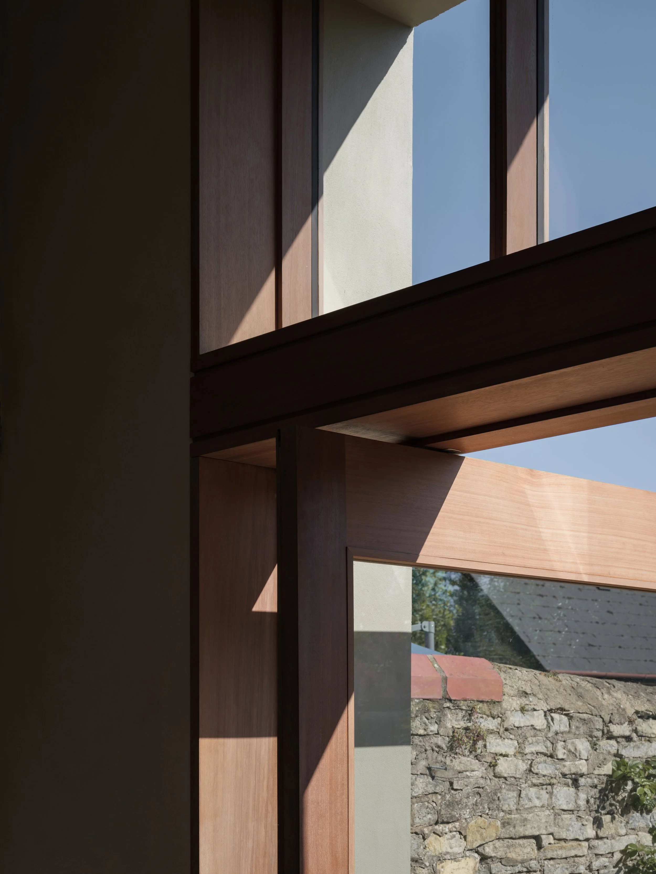 timber pivot door, lime plaster