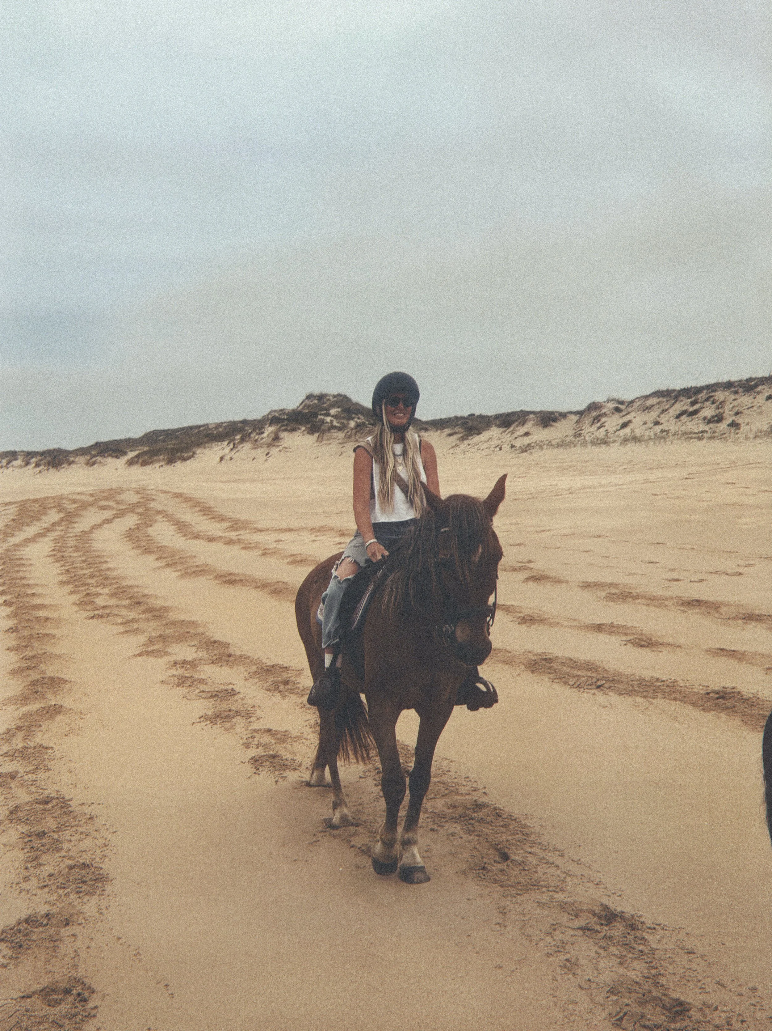 Group horseback ride on the beach near Peniche, Portugal